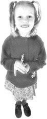 Young girl smiling and looking up at the camera
